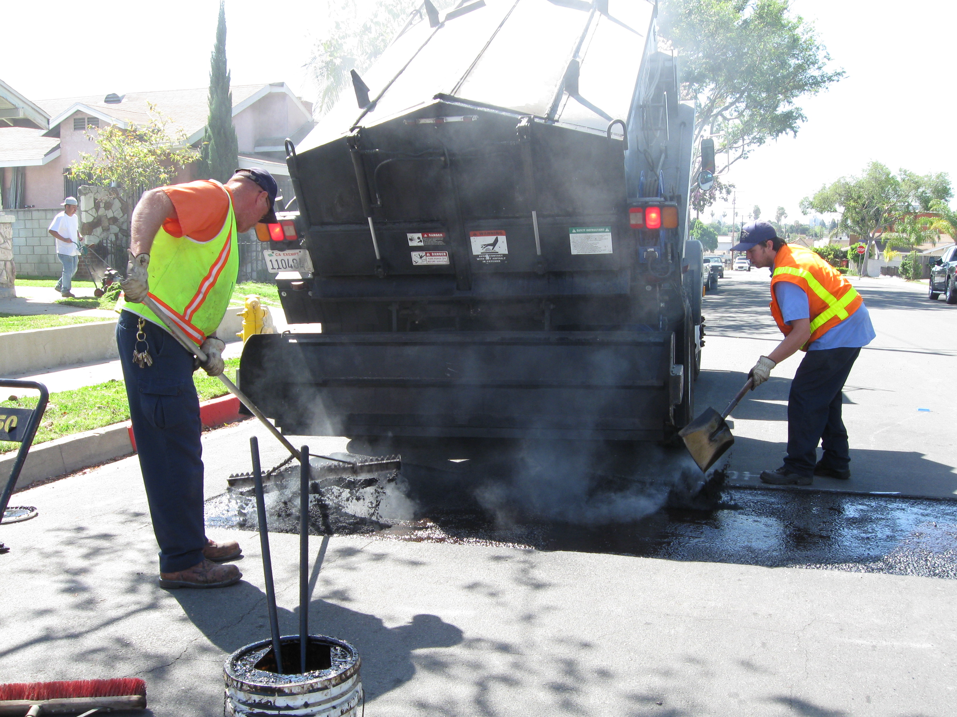 Two people working on a street